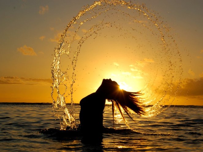 woman in sunset - namaste