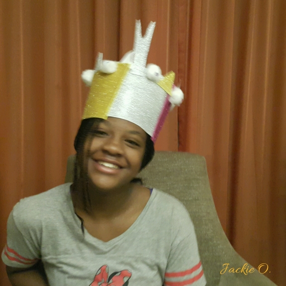 Wearing a crown painstakingly made by my younger brother :)