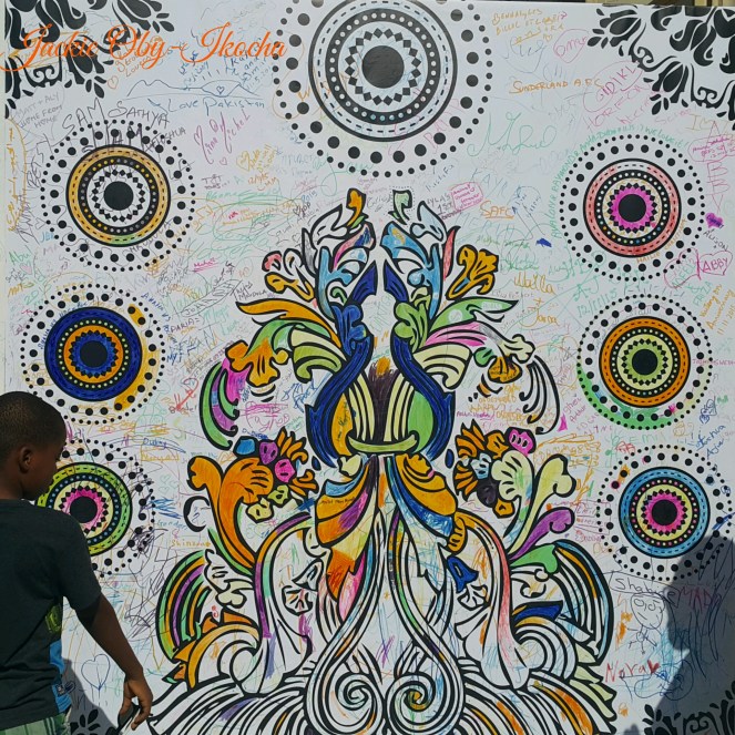 A big street art depicting harmony that had scribbles and signatures of thousands of people. We appended ours 😊