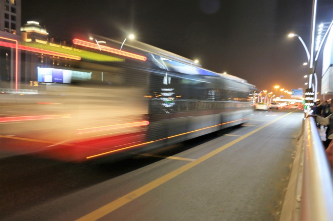 Fast moving bus, photograph